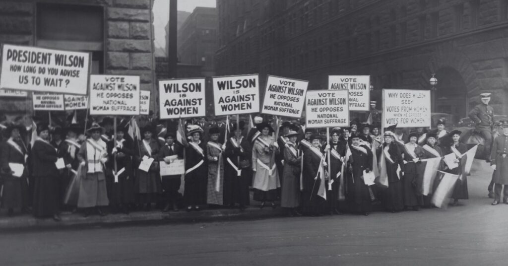Supporters of women's suffrage protested with signs that said "Wilson Against Women" in Chicago on October 20, 1916.